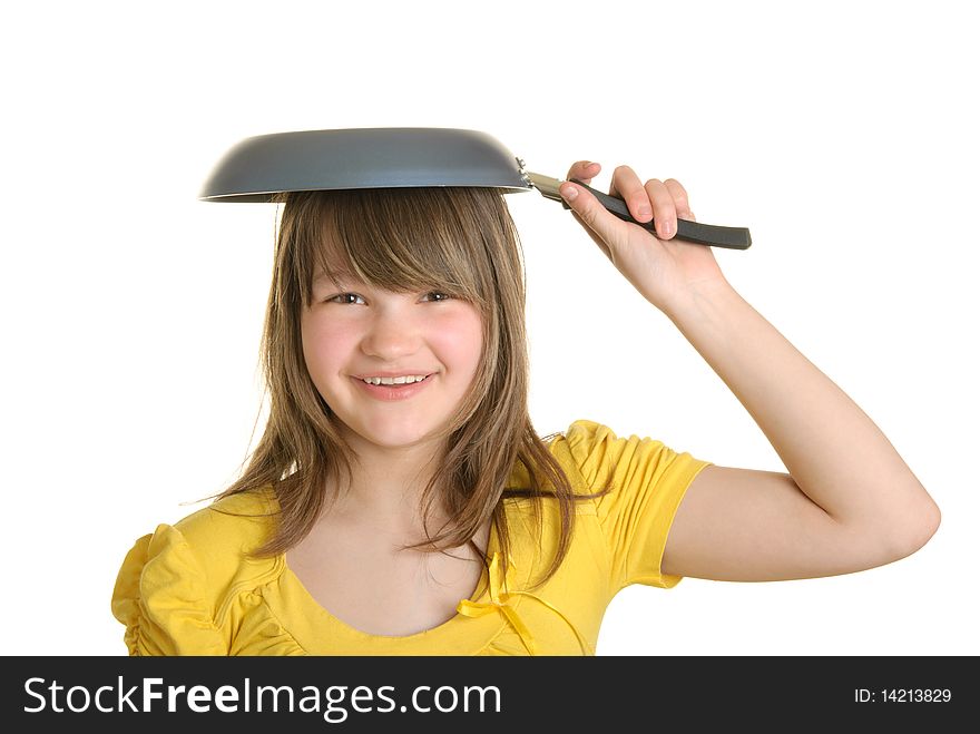 Girl holds frying pan on head and smiles