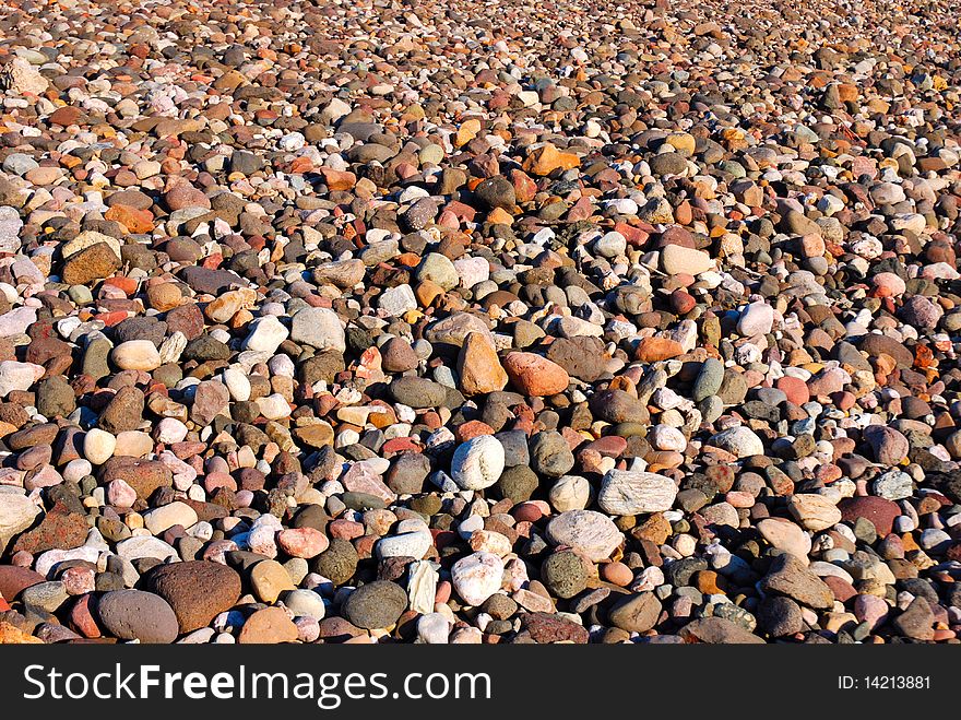 A textured background of beach pebbles.