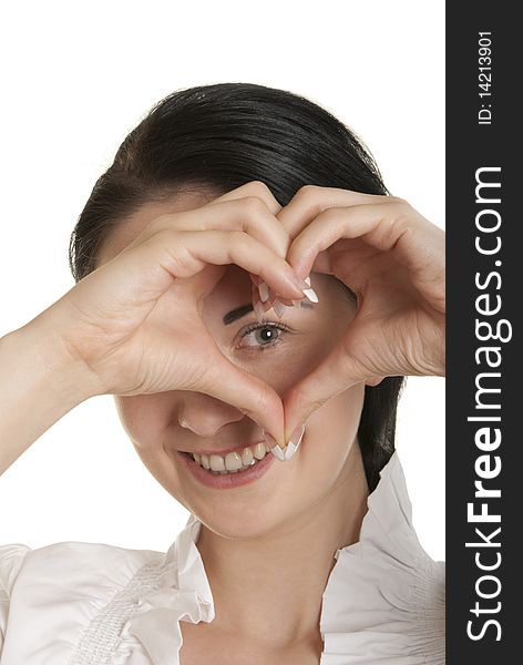 Young woman shows fingers heart symbol isolated in white