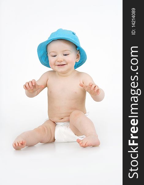 Merry child in blue hat on white background. Merry child in blue hat on white background.