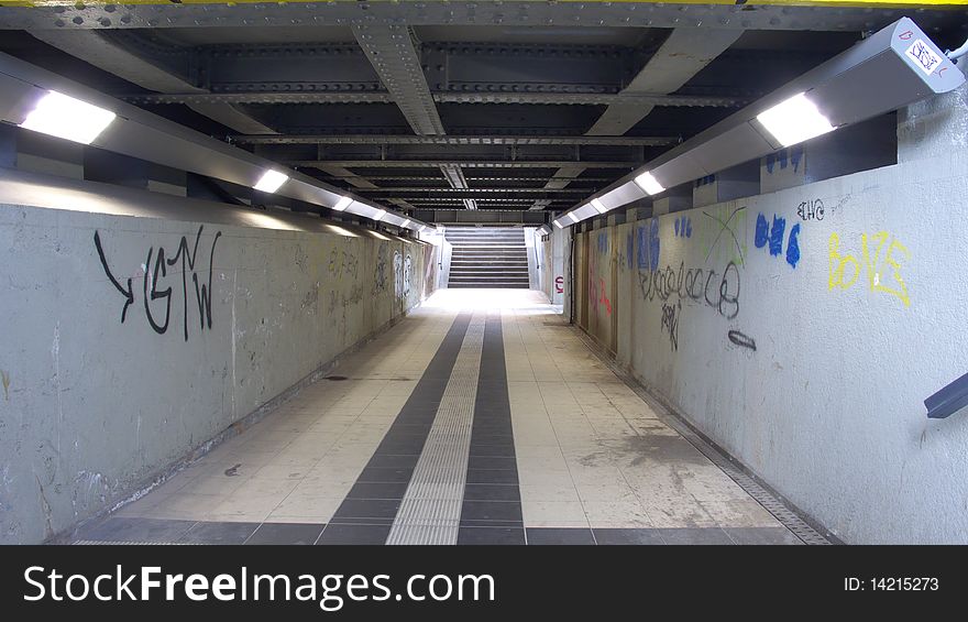 Vintage Tunnel Walkway at a Train Station with new Lights and ancient Steel Ceiling Construction Underpass