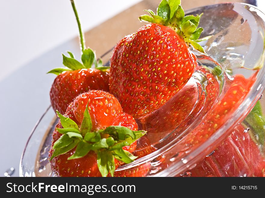 Food series: strawberry on the reflective surface