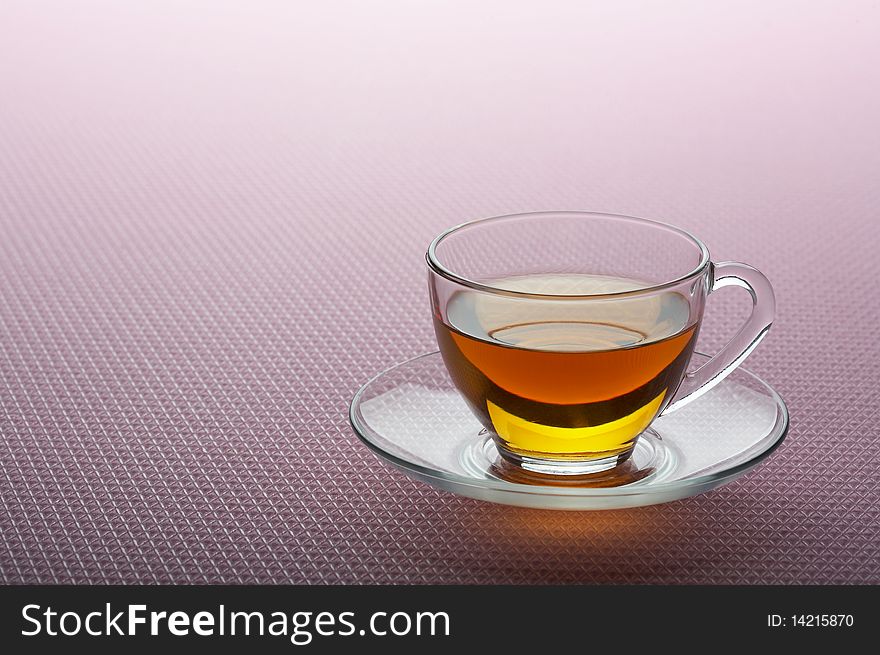 Tea cup on pink background