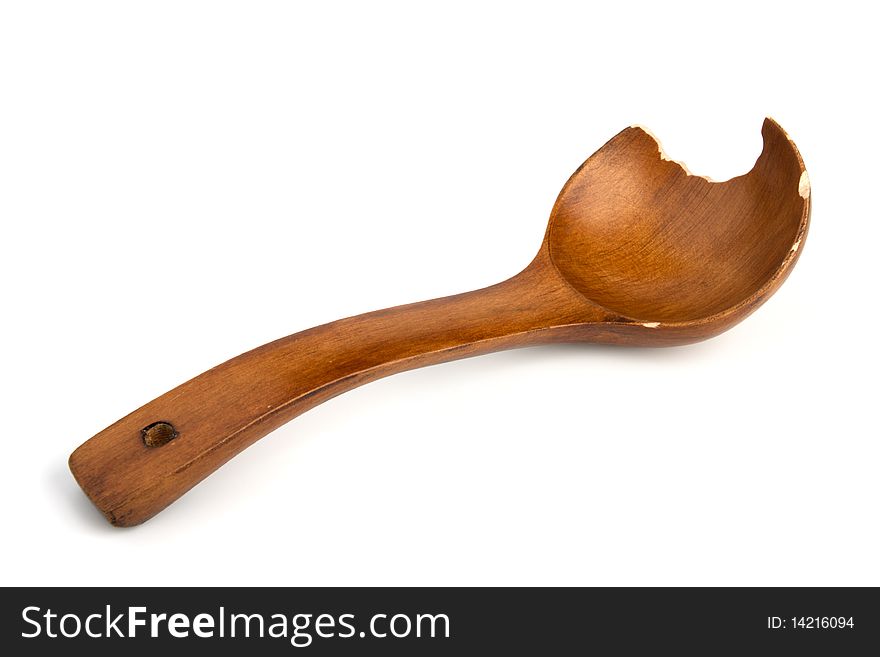 Brown wooden Spoon from which have bitten off a piece isolated on white background. Brown wooden Spoon from which have bitten off a piece isolated on white background