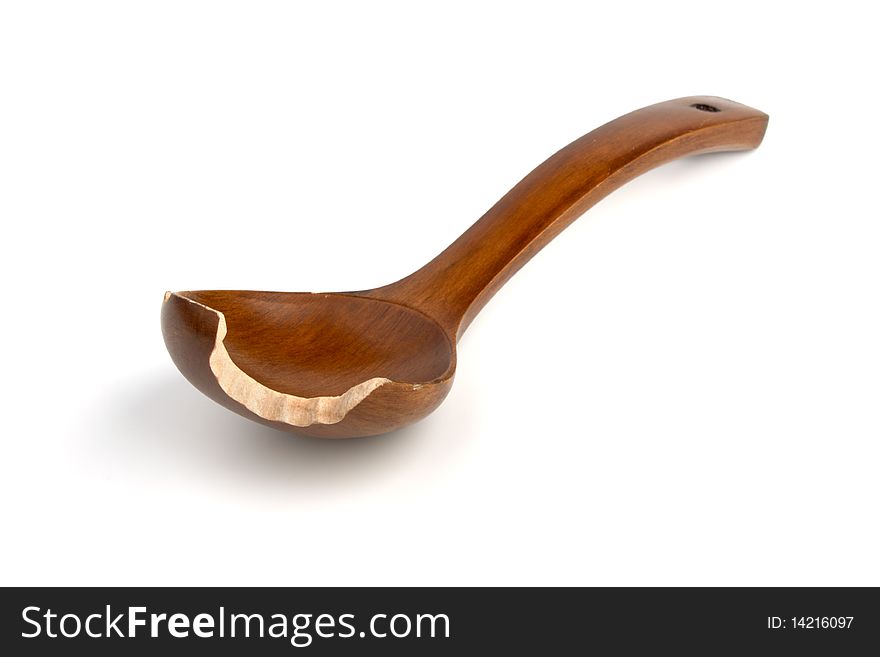 Brown wooden Spoon from which have bitten off a piece isolated on white background. Brown wooden Spoon from which have bitten off a piece isolated on white background