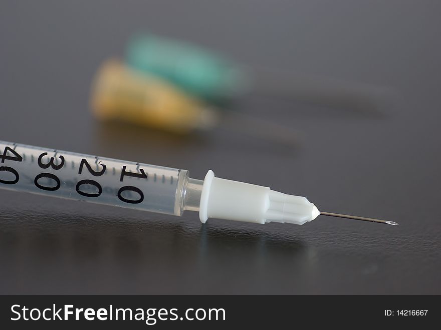 Medical syringe with a needle at the tip