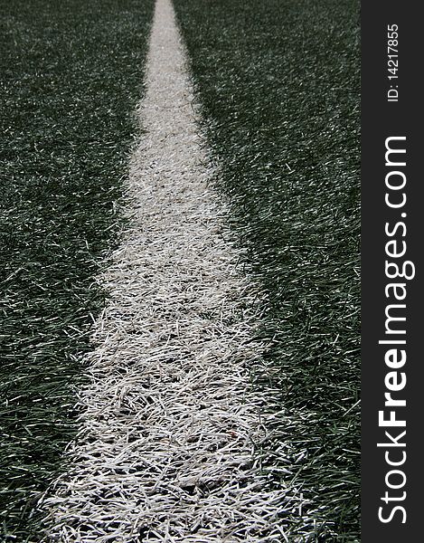 Closeup of white line of turf in stadium. Closeup of white line of turf in stadium