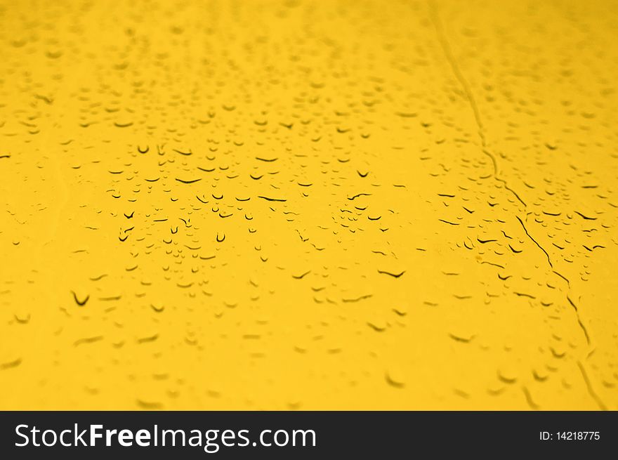 Yellow water drops background