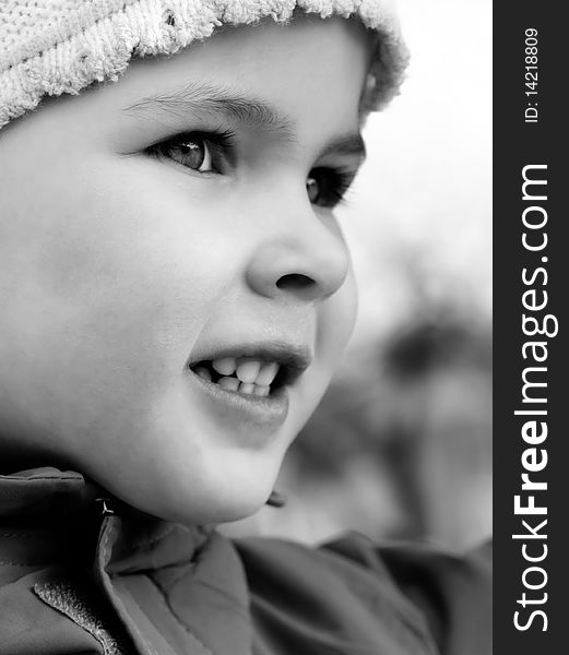 Beautiful little girl happily smiling closeup. Beautiful little girl happily smiling closeup