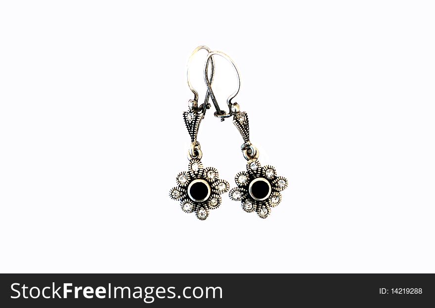 Silver earrings isolated on white background