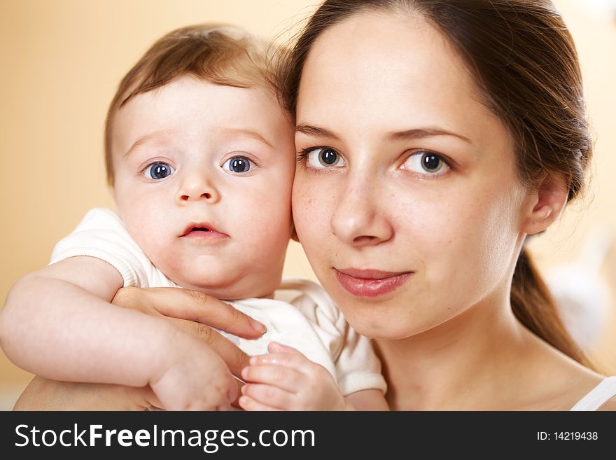 Closeup portrait happy young mother with baby boy