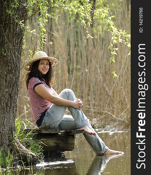 Girl resting near lake