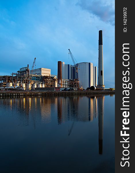 Demolition of an industrial factory at sunset