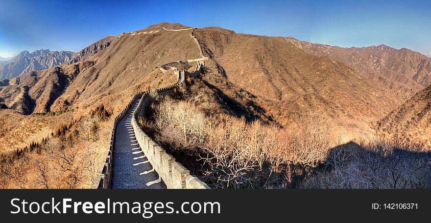 The great wall of China on a clear winter day with brown dry hills