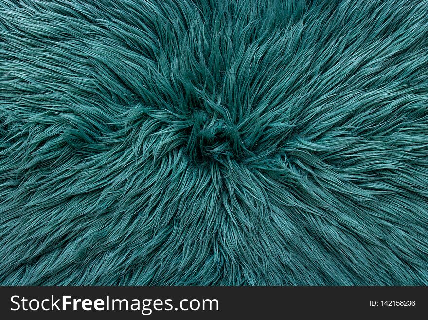 Blue green almost turquoise fake fur rug pattern. centered going out of frame of the image. Photo evenly lit with minimal shadow. Blue green almost turquoise fake fur rug pattern. centered going out of frame of the image. Photo evenly lit with minimal shadow.