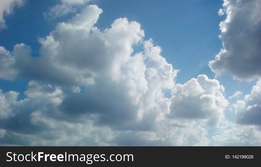 Scenic gorgeous morning March tropical sky with puffy big lighting clouds. Scenic gorgeous morning March tropical sky with puffy big lighting clouds