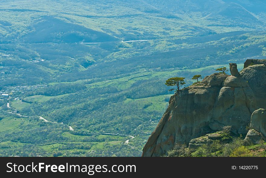 A bird view of a rock with a tree on it and valley in Crimea, Ukraine. A bird view of a rock with a tree on it and valley in Crimea, Ukraine