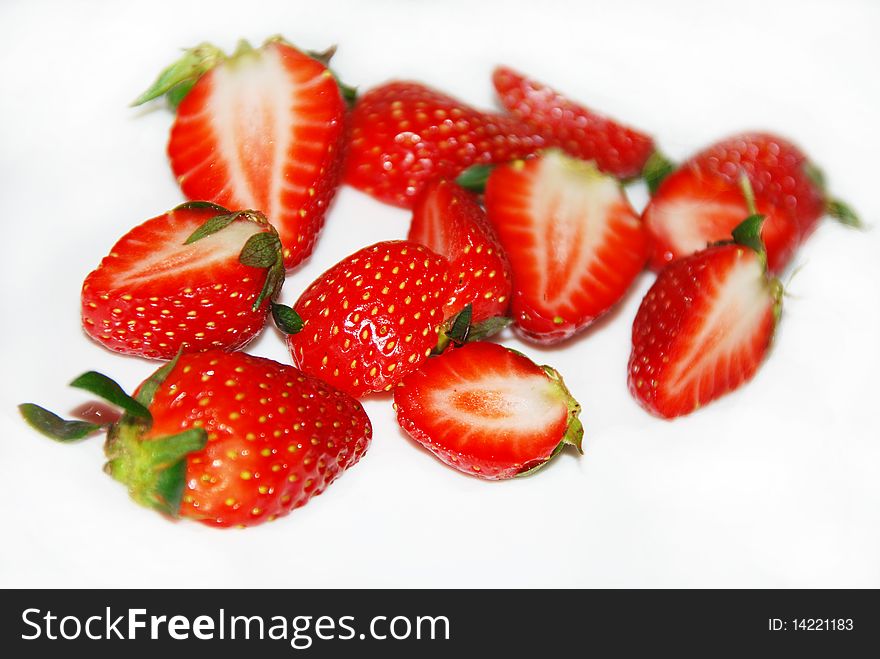 Cut strawberries isolated on the white background