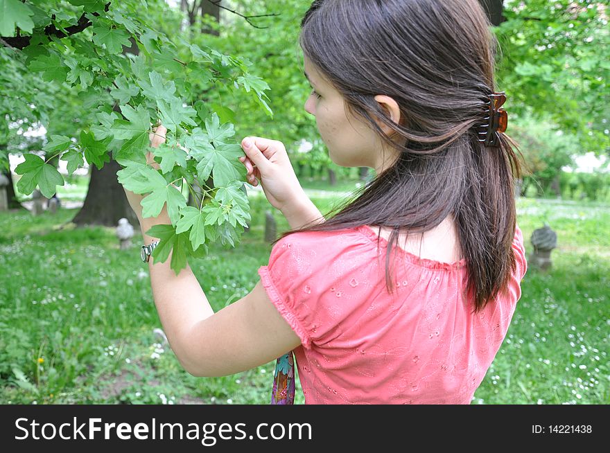 A Young Girl Explores The Trees