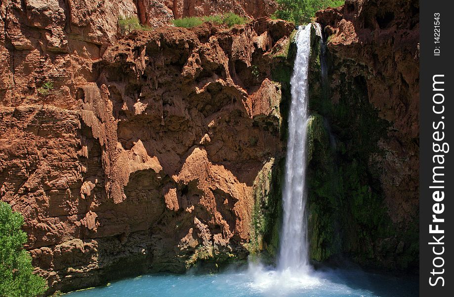 Mooney falls in the morning, and the mineral formed pools below. Mooney falls in the morning, and the mineral formed pools below