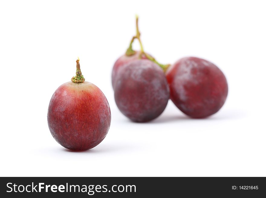 A grape isolated from other over white background. A grape isolated from other over white background.