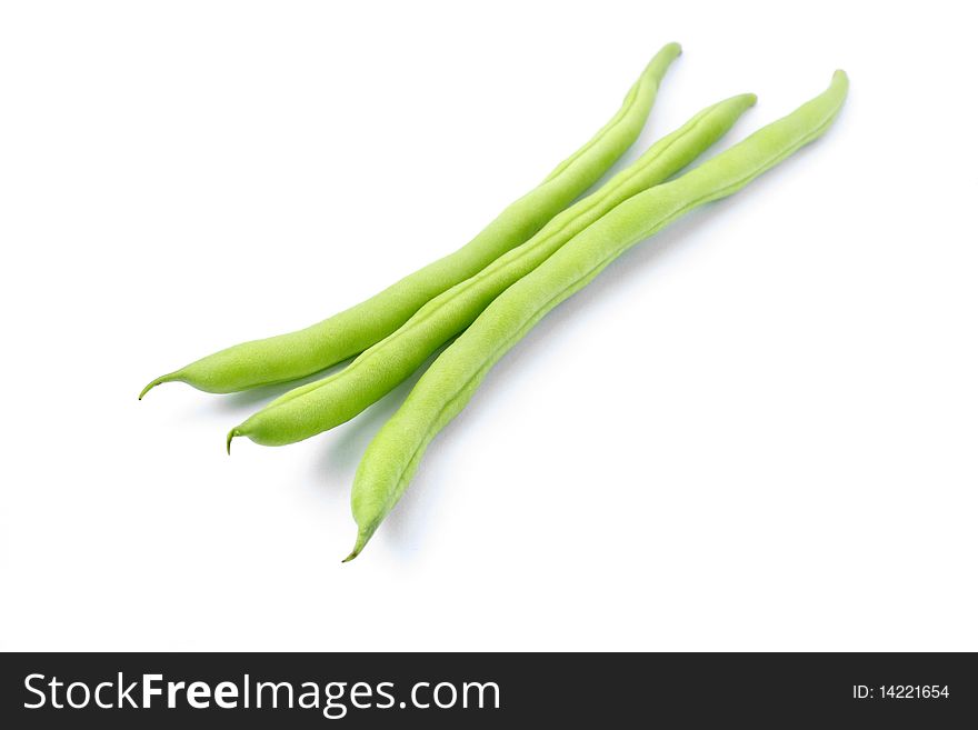 Three green french beans in isolated white background.