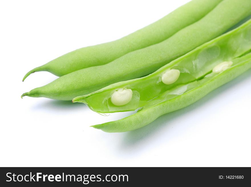 Pile of green french beans in isolated white background.