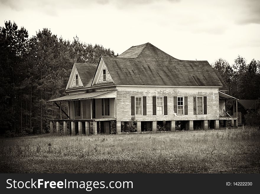 Old abandoned farm house sepia vignetted. Old abandoned farm house sepia vignetted