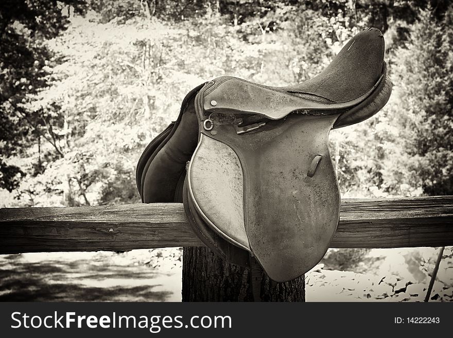 Horse Saddle On Wood Fence