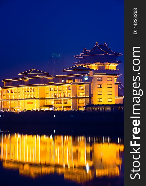 The chinese building in night by the river.