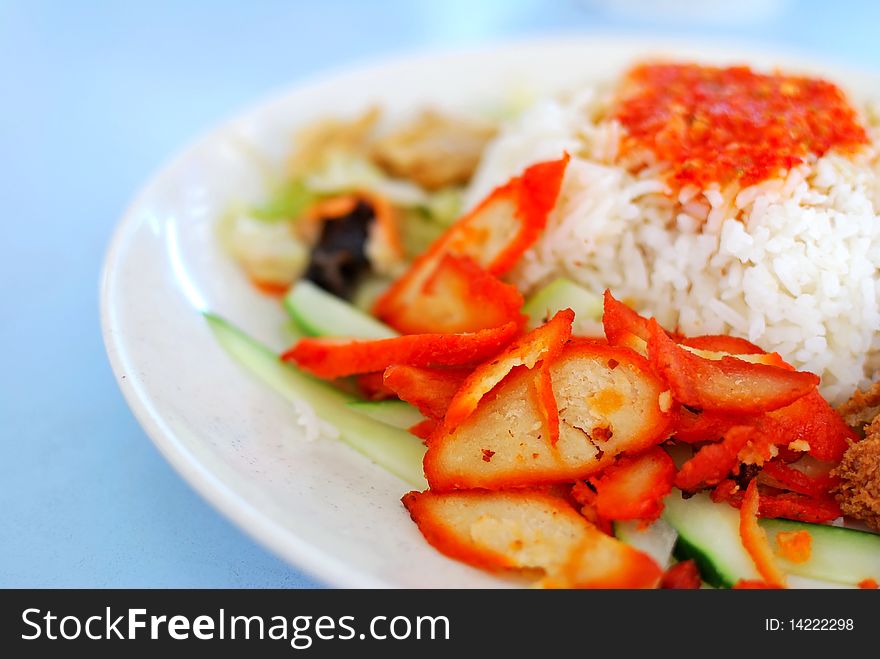 Asian style vegetarian barbecued pork delicacy with spicy chili sauce. Concepts such as diet and nutrition, healthy eating and lifestyle, and food and beverage.