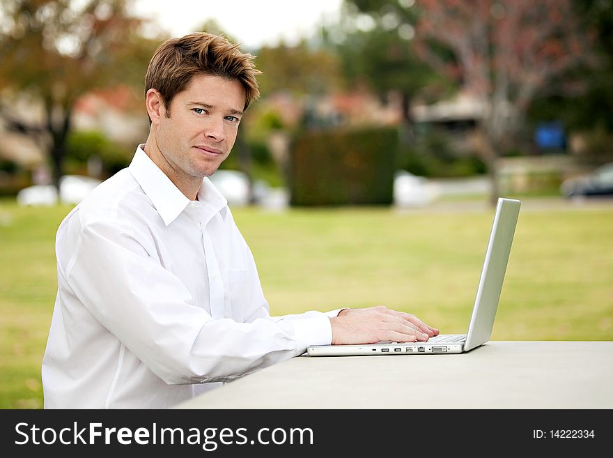 Young business man working outside. Young business man working outside