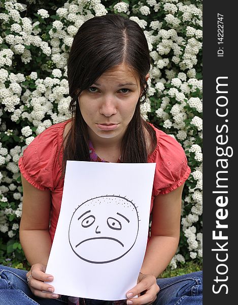 Beautiful Girl Holding A Paper With A Drawn Face E
