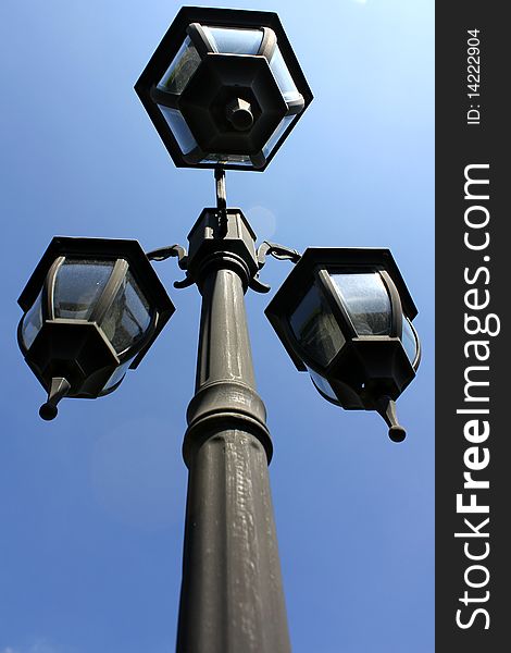 Lamp post under the blue sky