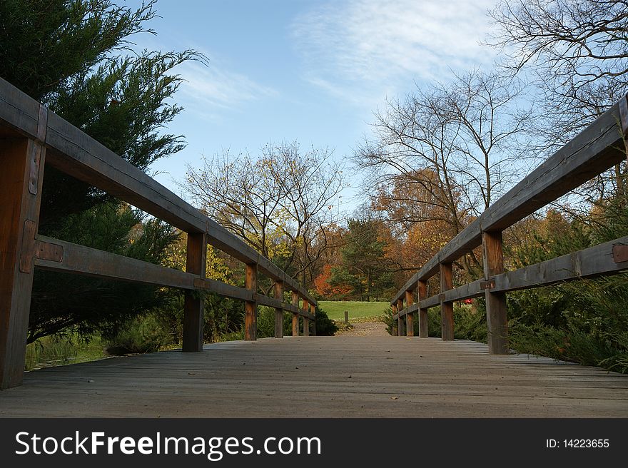 Moscow, Russia, a wooden bridge in the autumn park in the center. Moscow, Russia, a wooden bridge in the autumn park in the center