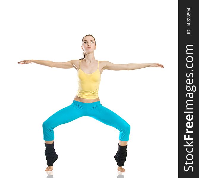 Beautiful girl doing gymnastics on white background