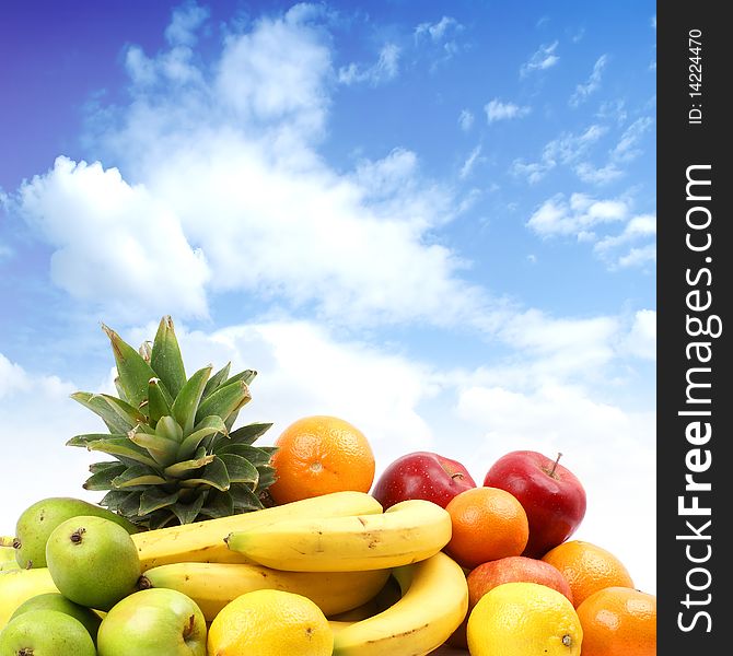 Different juicy fruits on a sky background