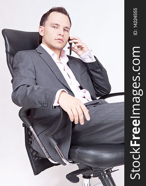 Young businessman sitting on chair