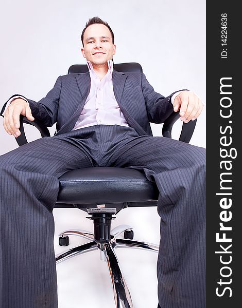 Young businessman sitting on chair