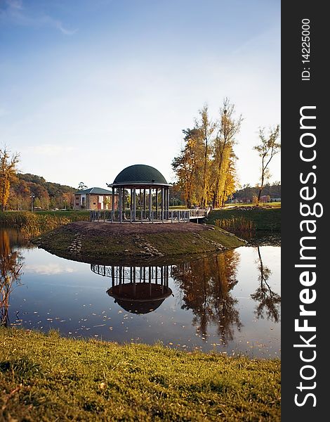 The autumn landscape is in the reflection of water