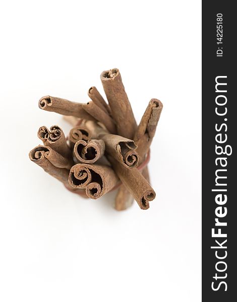 Cinnamon sticks in group on white background