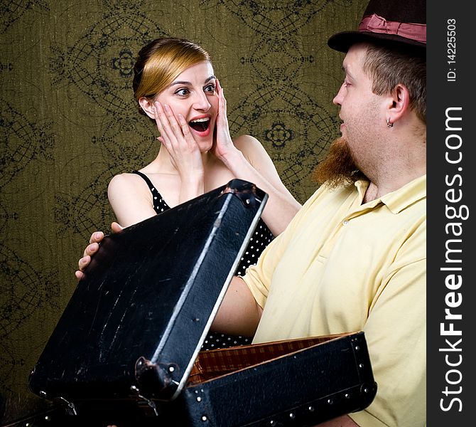 An image of a woman and a man with a valise. An image of a woman and a man with a valise
