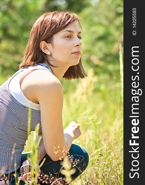 Pretty smiling girl relaxing outdoor. Pretty smiling girl relaxing outdoor