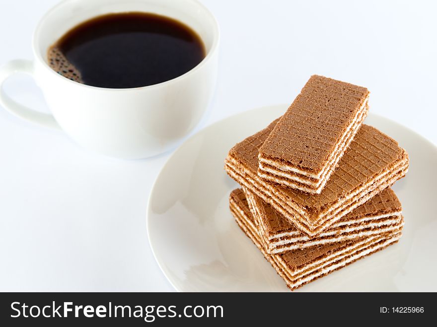 Coffee and wafers on the plate