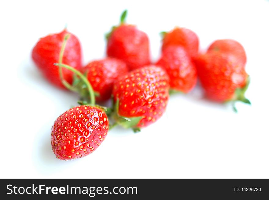 Fresh red strawberry blurred and isolated on a white background