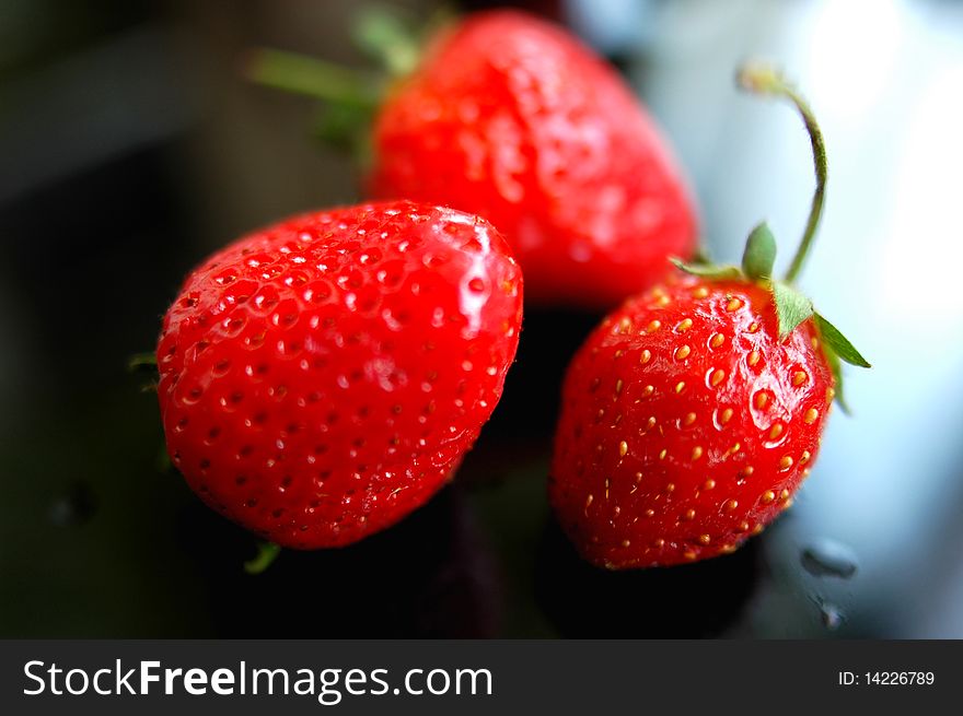 Fresh red strawberry isolated on a blurred background