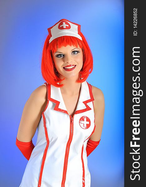 Young beautiful nurse in uniform and red hair. Young beautiful nurse in uniform and red hair