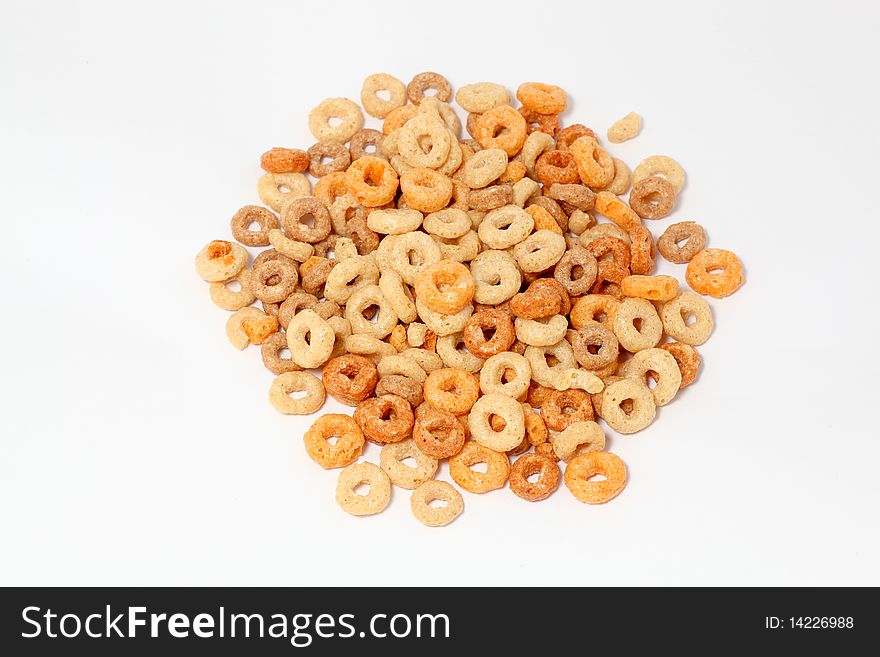 Oat hoops scattered on a white background