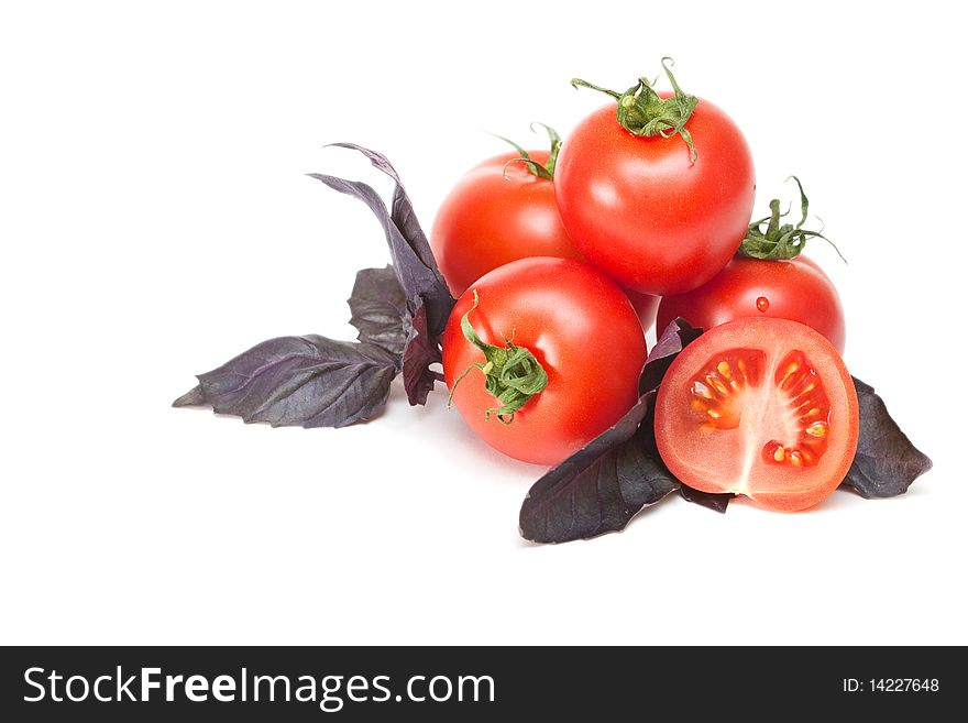 Tomato with basil on a white background