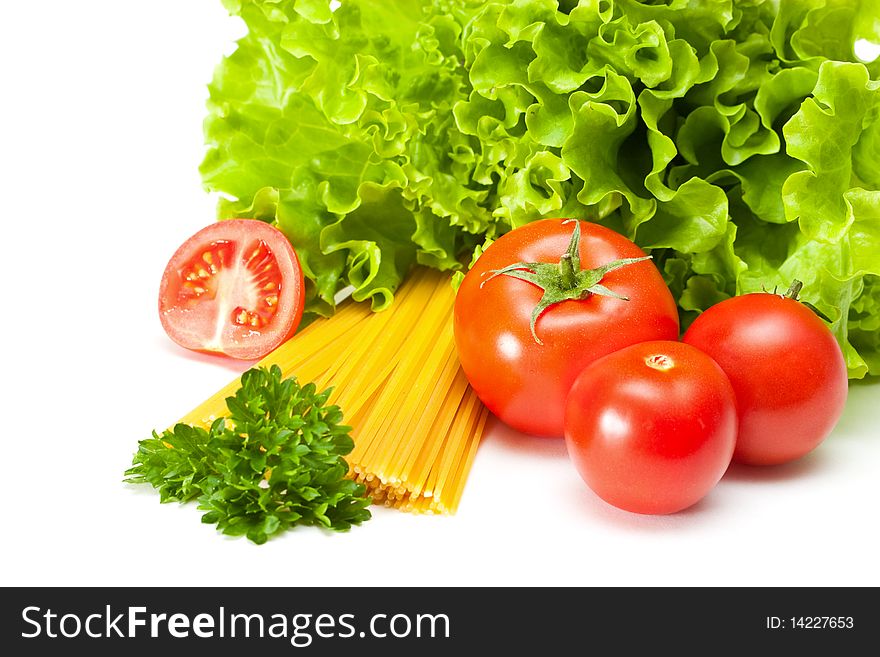 Tomato with salad and pasta on a white background